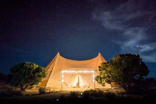 night sky beige tent under starry skies camping